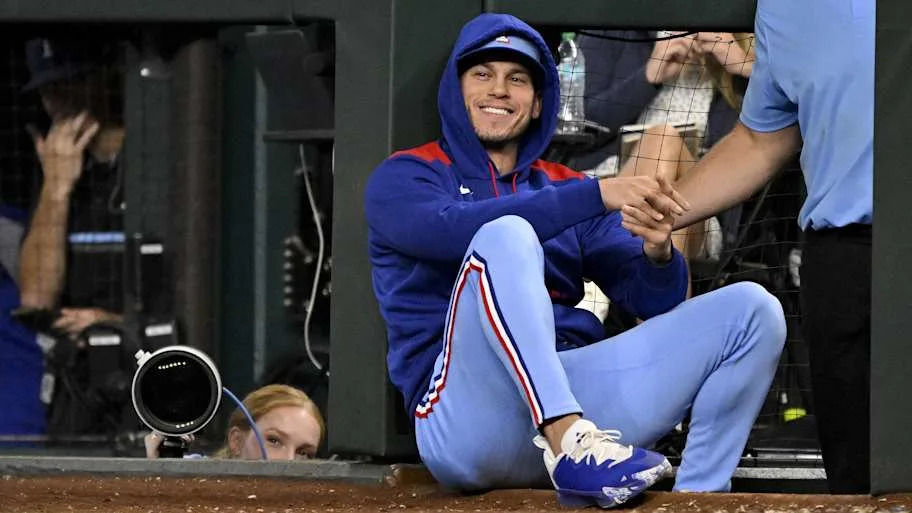 Texas Rangers center fielder Sam Haggerty smiles after getting hit by a foul ball. 