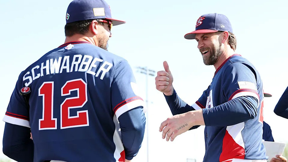 <div>PHOENIX, ARIZONA - MARCH 02: Bryce Harper #24 of Team USA gestures to Kyle Schwarber #12 during a workout at Papago Park Sports Complex on March 02, 2026 in Phoenix, Arizona. (Photo by Chris Coduto/Getty Images)</div>