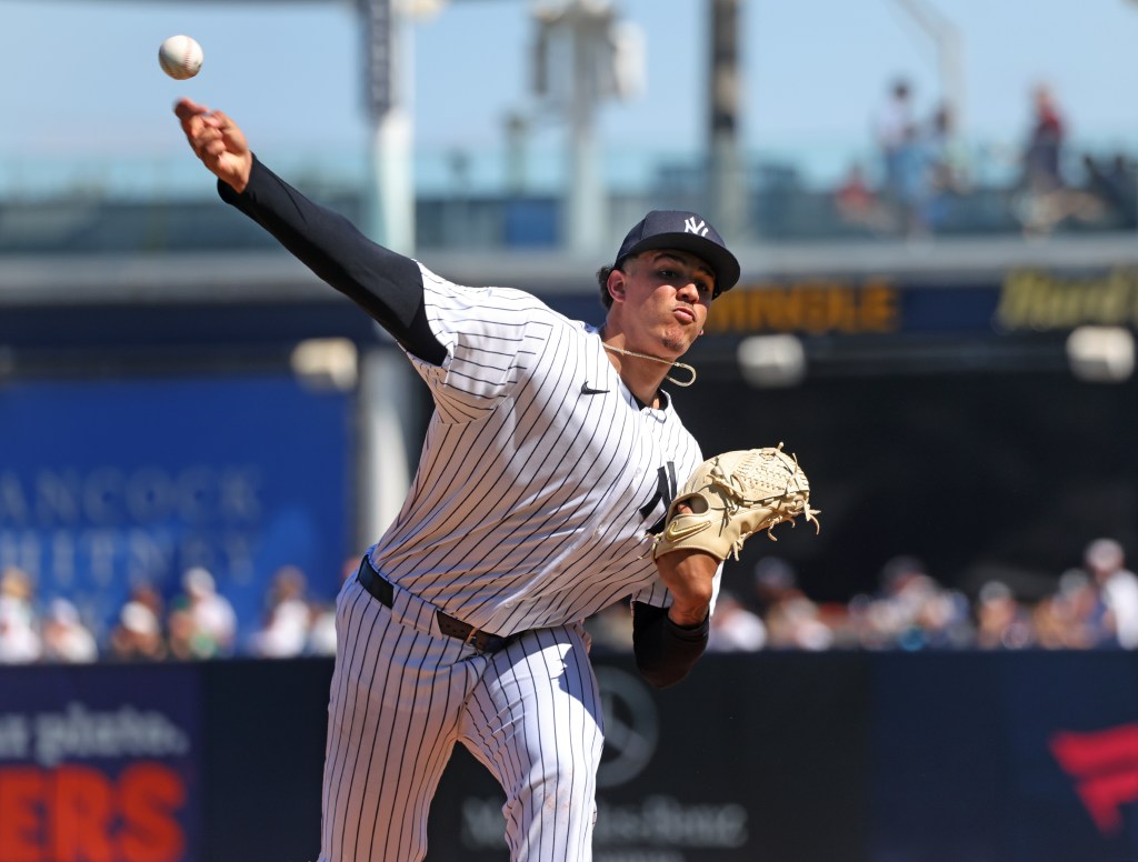 New York Yankees pitcher Carlos Lagrange #84, throwing a warmup pitch before the start of the 2nd inning.