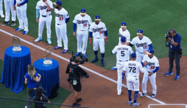 Mar 26, 2026; Los Angeles, California, USA; Los Angeles Dodgers infielders Freddie Freeman (5) and Miguel Rojas (72) greet manager Dave Roberts (30) and designated hitter Shohei Ohtani before the game against the Arizona Diamondbacks at Dodger Stadium. Mandatory Credit: Kirby Lee-Imagn Images