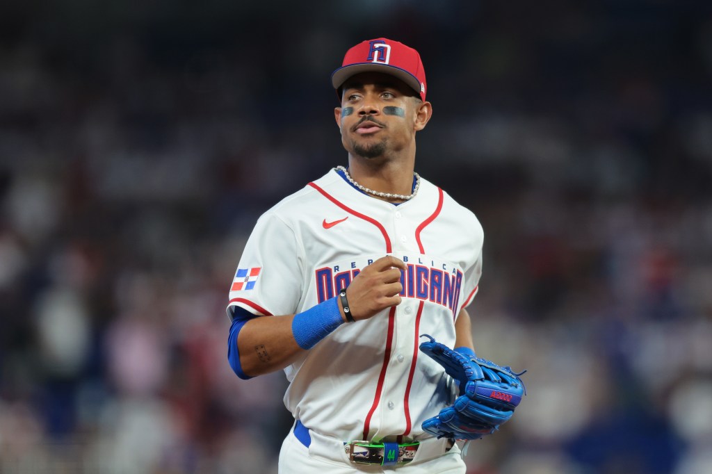 Dominican Republic center fielder Julio Rodriguez (44) returns to the dugout against the Netherlands during the sixth inning.