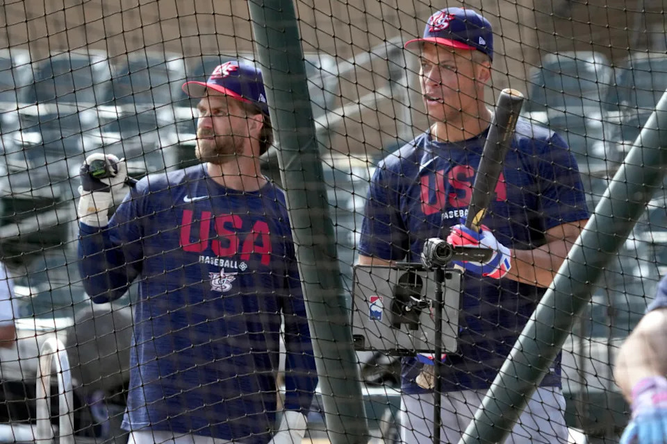 Mar 4, 2026; Scottsdale, AZ, USA; United States first baseman Bryce Harper (24) and right fielder Aaron Judge (99) takes batting practice before a game against the Colorado Rockies at Salt River Fields. Mandatory Credit: Rick Scuteri-Imagn Images