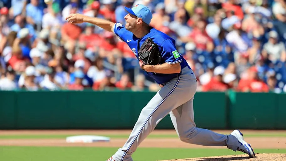 Max Scherzer throws a pitch in a blue Blue Jays uniform