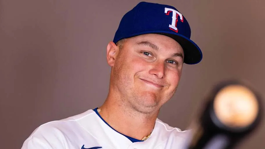 Texas Rangers designated hitter Joc Pederson poses with a bat in his hands