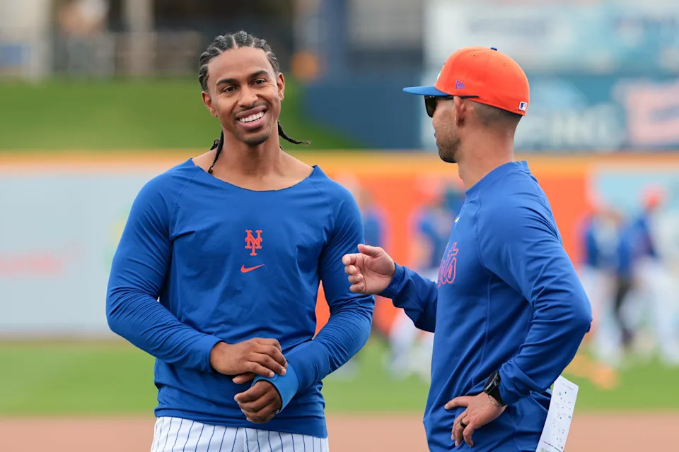 New York Mets infielder Francisco Lindor (12) speaks to bench coach Kai Correa (50) during spring training on Feb. 17, 2026, at Clover Park.