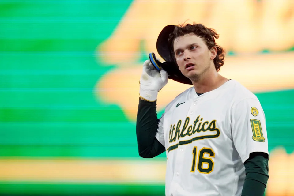 Apr 23, 2025; West Sacramento, California, USA; Athletics first baseman Nick Kurtz (16) takes off his helmet after a play against the Texas Rangers in the second inning at Sutter Health Park. Mandatory Credit: Cary Edmondson-Imagn Images