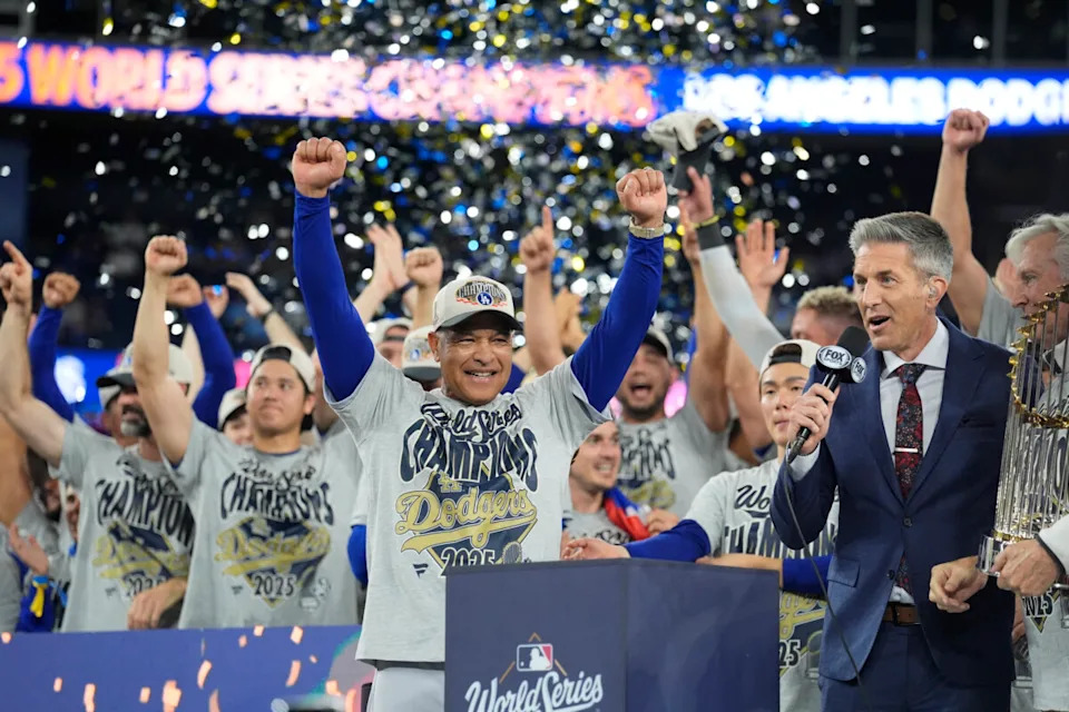 Los Angeles Dodgers manager Dave Roberts (30) celebrates on the podium during the post game celebration after defeating the Toronto Blue Jays in the 2025 MLB World Series at Rogers Centre.