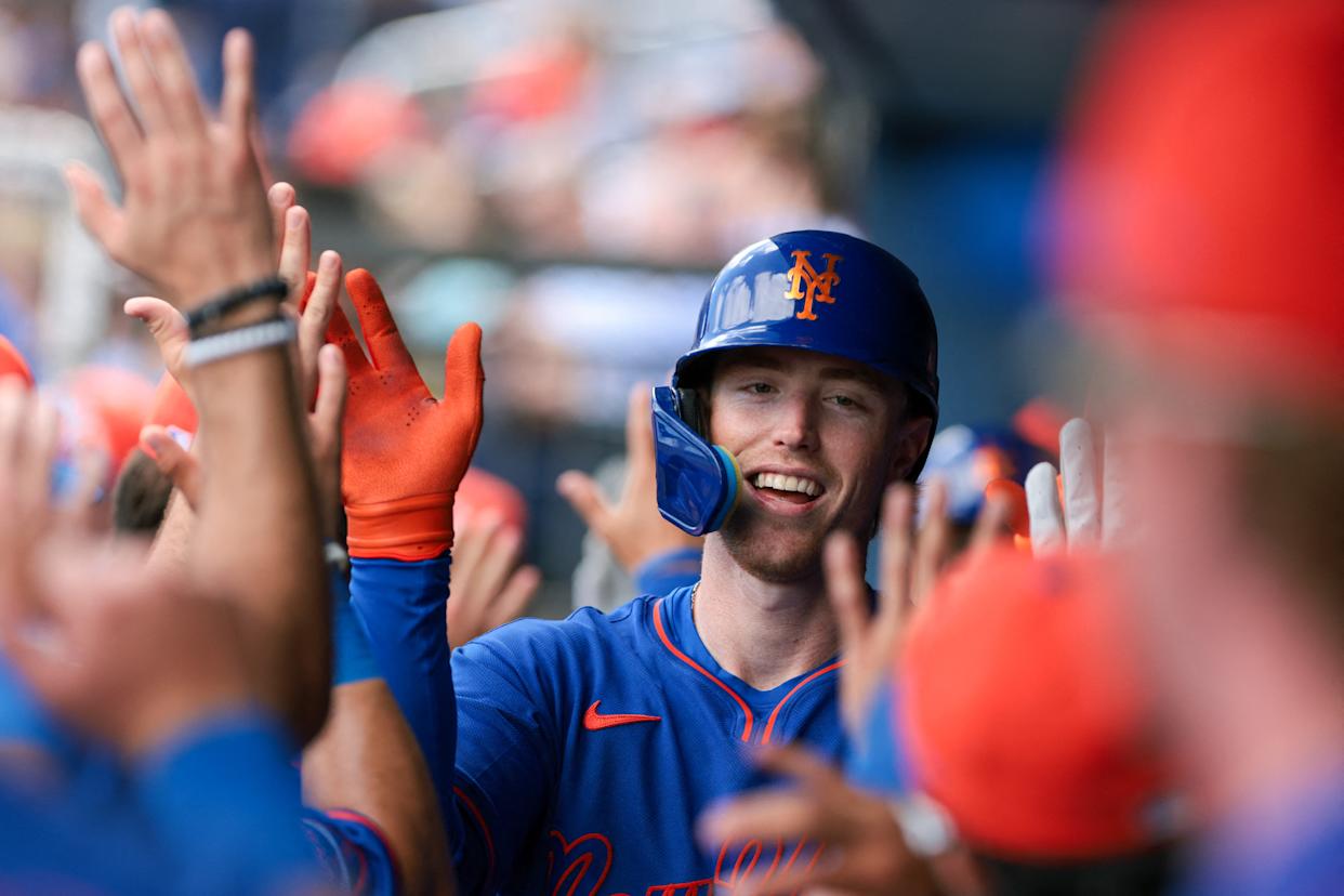 New York Mets right fielder Brett Baty (7) celebrates with teammates in the dugout.