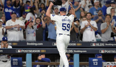 Oct 11, 2024; Los Angeles, California, USA; Los Angeles Dodgers pitcher Evan Phillips (59) reacts after being relieved in the seventh inning against the San Diego Padres during game five of the NLDS for the 2024 MLB Playoffs at Dodger Stadium. Mandatory Credit: Jayne Kamin-Oncea-Imagn Images