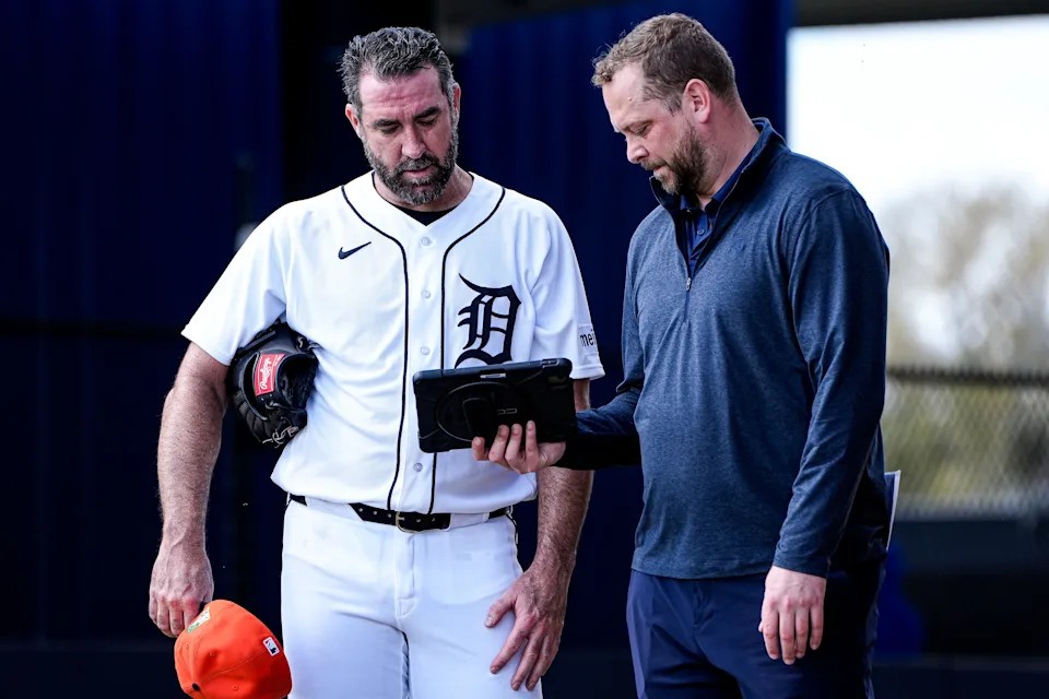 Detroit Tigers pitcher Justin Verlander, talks to Major League Video Operations Coordinator Austin Tripp, after practice during spring training at TigerTown in Lakeland, Fla. on Wednesday, Feb. 18, 2026.