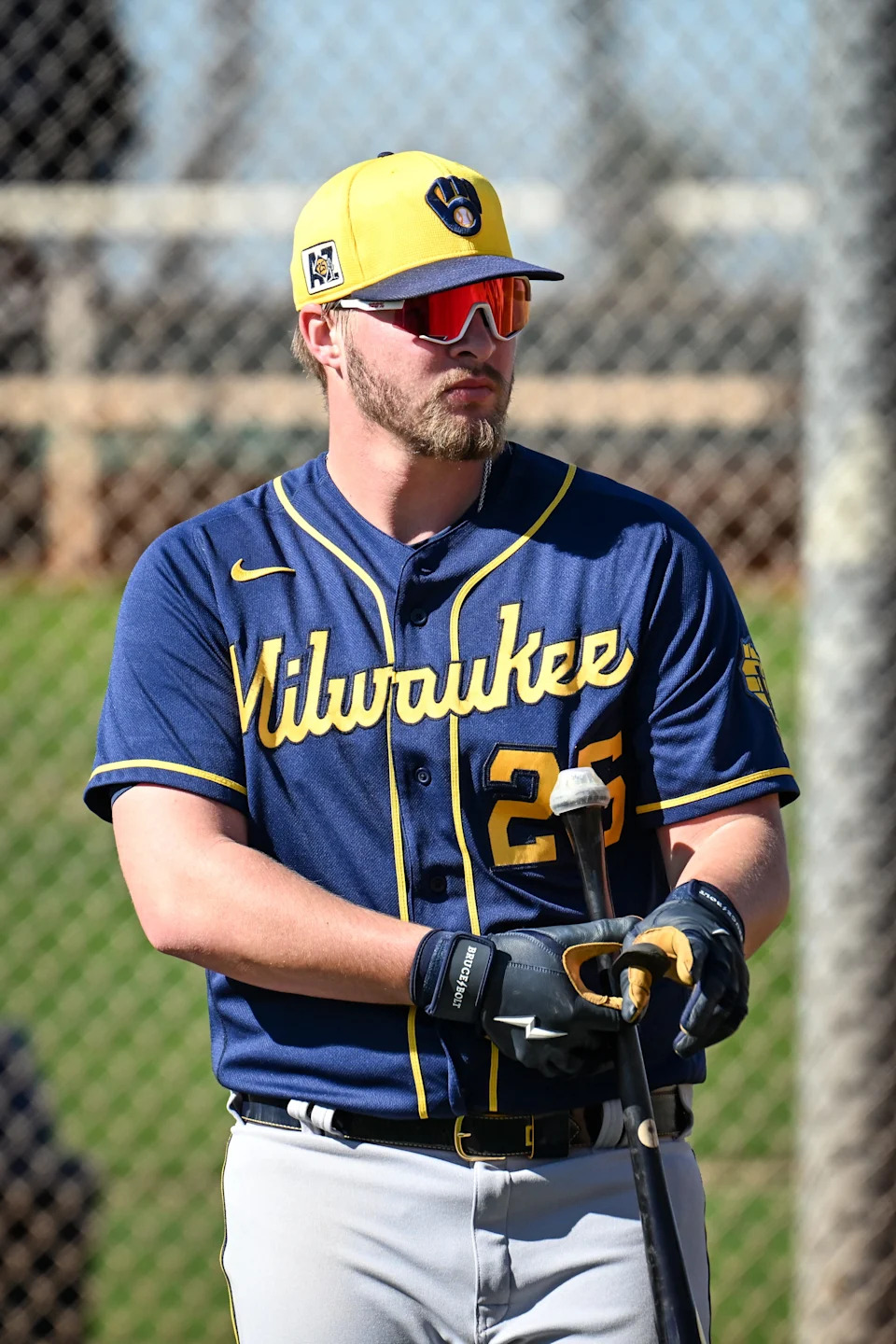 Milwaukee Brewers first baseman Blake Burke waits his turn in the batting cage during spring training on February 15, 2025, at the American Family Fields of Phoenix in Phoenix, Arizona.