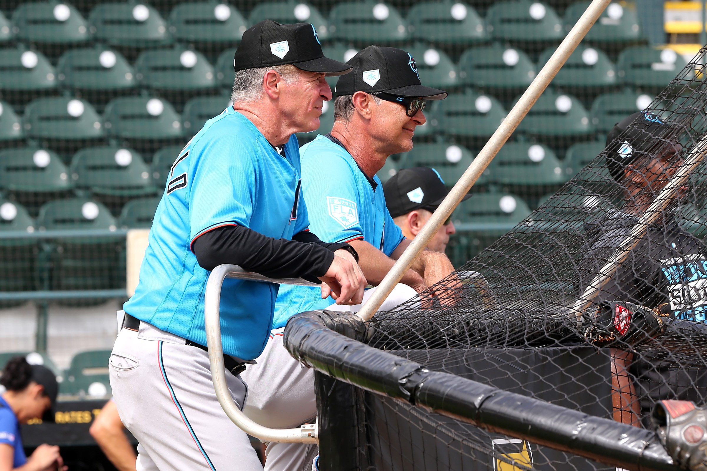 BRADENTON, FL - FEB 24: Marlins hitting coach Mike Pagliarulo (6) and Manager Don Mattingly watch during the spring training game between the Miami Marlins and the Pittsburgh Pirates on February 24, 2019, at the LECOM Stadium in Bradenton, FL. (Photo by Cliff Welch/Icon Sportswire via Getty Images)