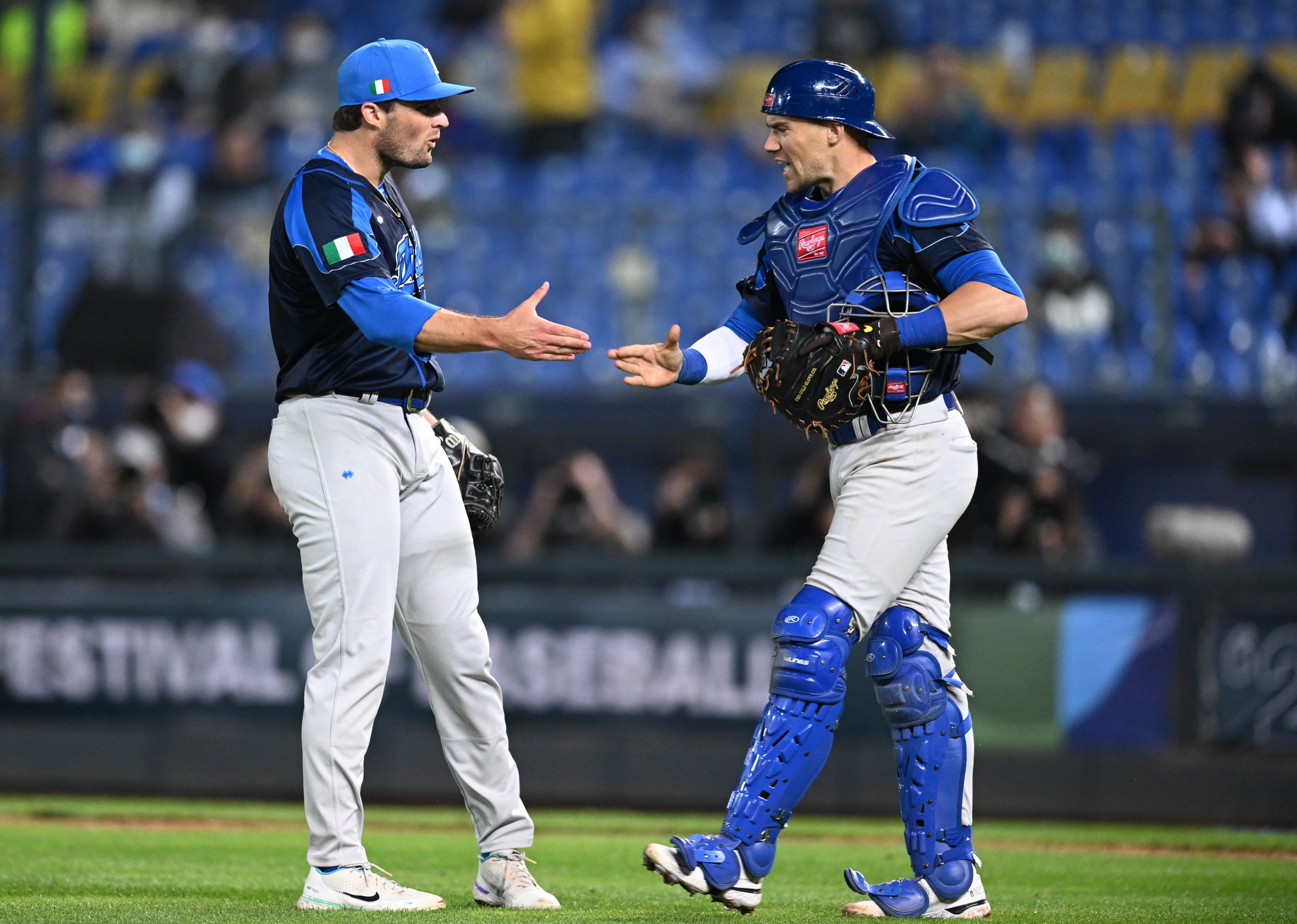 TAICHUNG, TAIWAN - MARCH 09: Mitchell Stumpo (L) #18 of Team Italy celebrates with Brett Sullivan (R) #12 of Team Italy after pitchs at the bottom of the 10th inning during the World Baseball Classic Pool A game between Italy and Cuba at Taichung Intercontinental Baseball Stadium on March 09, 2023 in Taichung, Taiwan. (Photo by Gene Wang/Getty Images)