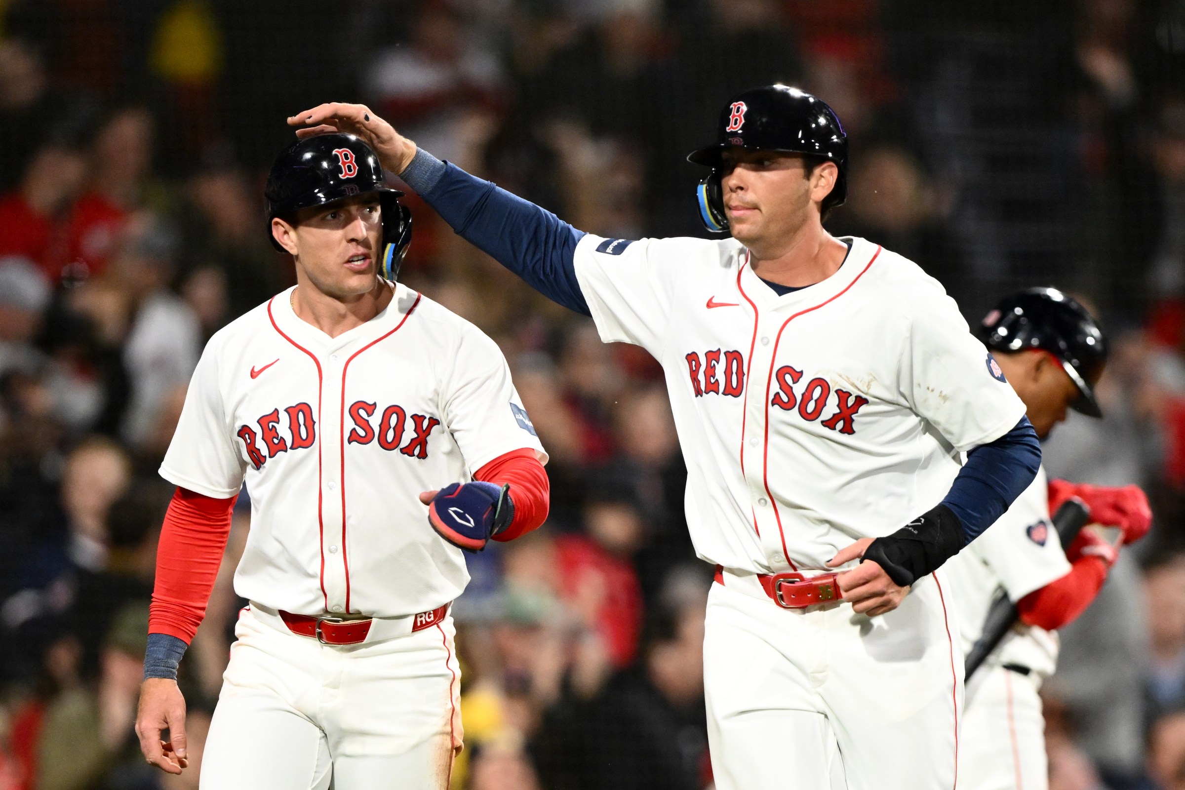 BOSTON, MASSACHUSETTS - APRIL 10: Triston Casas #36 (L) and Romy Gonzalez #23 of the Boston Red Sox celebrate after scoring on a two-run single off the bat of Connor Wong in the fourth inning against the Baltimore Orioles at Fenway Park on April 10, 2024 in Boston, Massachusetts. (Photo by Brian Fluharty/Getty Images)