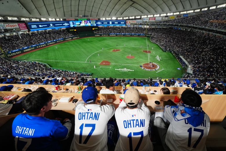 Fans watch the Dodgers and the Cubs play at the Tokyo Dome.