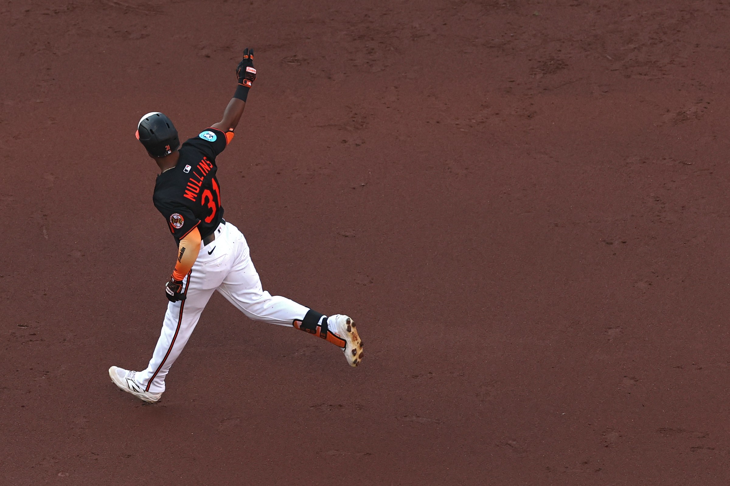 BALTIMORE, MARYLAND - JULY 28: Cedric Mullins #31 of the Baltimore Orioles celebrates after hitting a home run against the Toronto Blue Jays during the second inning at Oriole Park at Camden Yards on July 28, 2025 in Baltimore, Maryland.