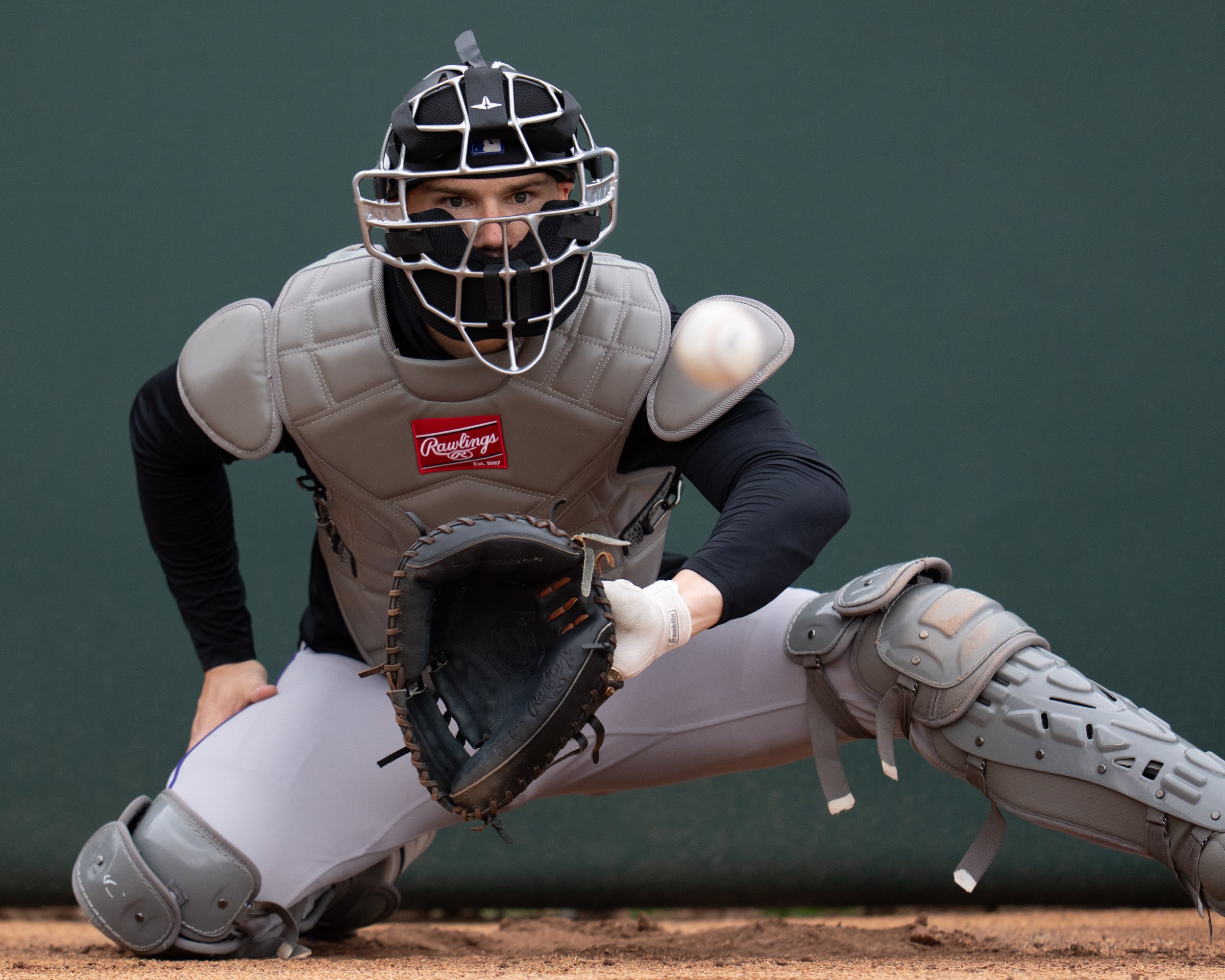 SCOTTSDALE, ARIZONA - FEBRUARY 13: Brett Sullivan #26 of the Colorado Rockies looks to catch a pitch during a spring training bullpen at Salt River Fields at Talking Stick on February 13, 2026 in Scottsdale, Arizona. (Photo by Kyle Cooper/Colorado Rockies/Getty Images)