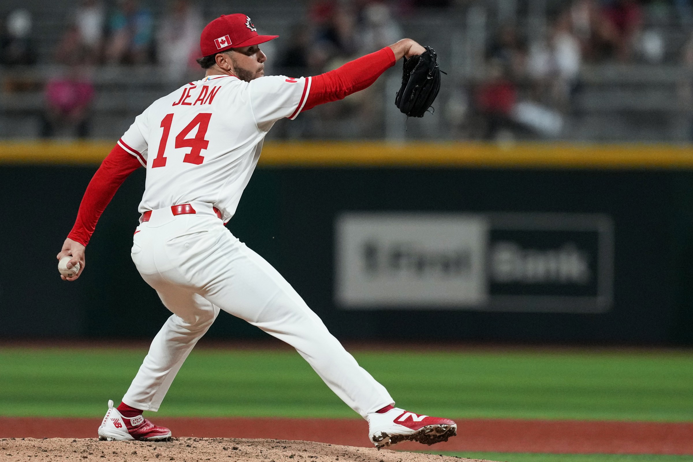 SAN JUAN, PUERTO RICO - MARCH 08: Antoine Jean #14 of Team Canada pitches during the 2026 World Baseball Classic Pool A game presented by Capital One between Team Panama and Team Canada at Hiram Bithorn Stadium on Sunday, March 8, 2026 in San Juan, Puerto Rico. (Photo by Mary DeCicco/WBCI/MLB Photos via Getty Images)