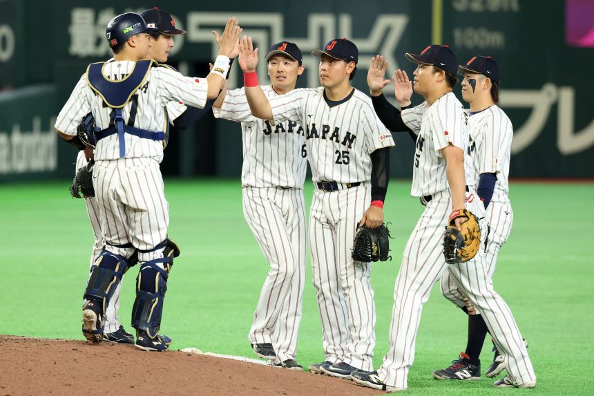 Members of Team Japan celebrate a World Baseball Classic win earlier this month.