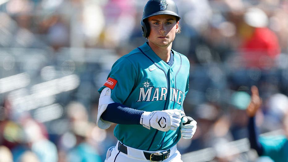 PEORIA, ARIZONA - MARCH 11: Colt Emerson #85 of the Seattle Mariners jogs to the dugout during a Spring Training game against the Colorado Rockies at Peoria Stadium on March 11, 2026 in Peoria, Arizona.