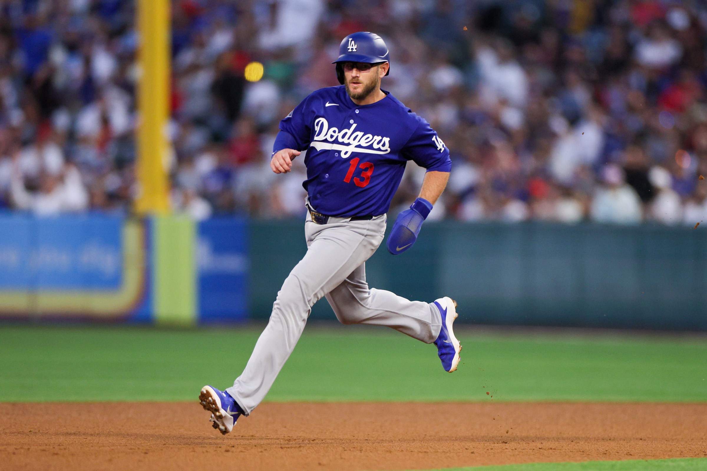Los Angeles, CA - March 15 : Los Angeles Dodger third basemen Max Muncy (13) runs to second base during the third inning of a MLB spring training against the Los Angeles Angels at Angel Stadium on Sunday, March 22, 2026 in Anahiem , CA. (Photo by Ronaldo Bolaños/Los Angeles Times via Getty Images)