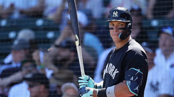 MESA, ARIZONA - MARCH 23: Aaron Judge #99 of the New York Yankees warms up on deck during the first inning of the spring training game against the Chicago Cubs at Sloan Park on March 23, 2026 in Mesa, Arizona.