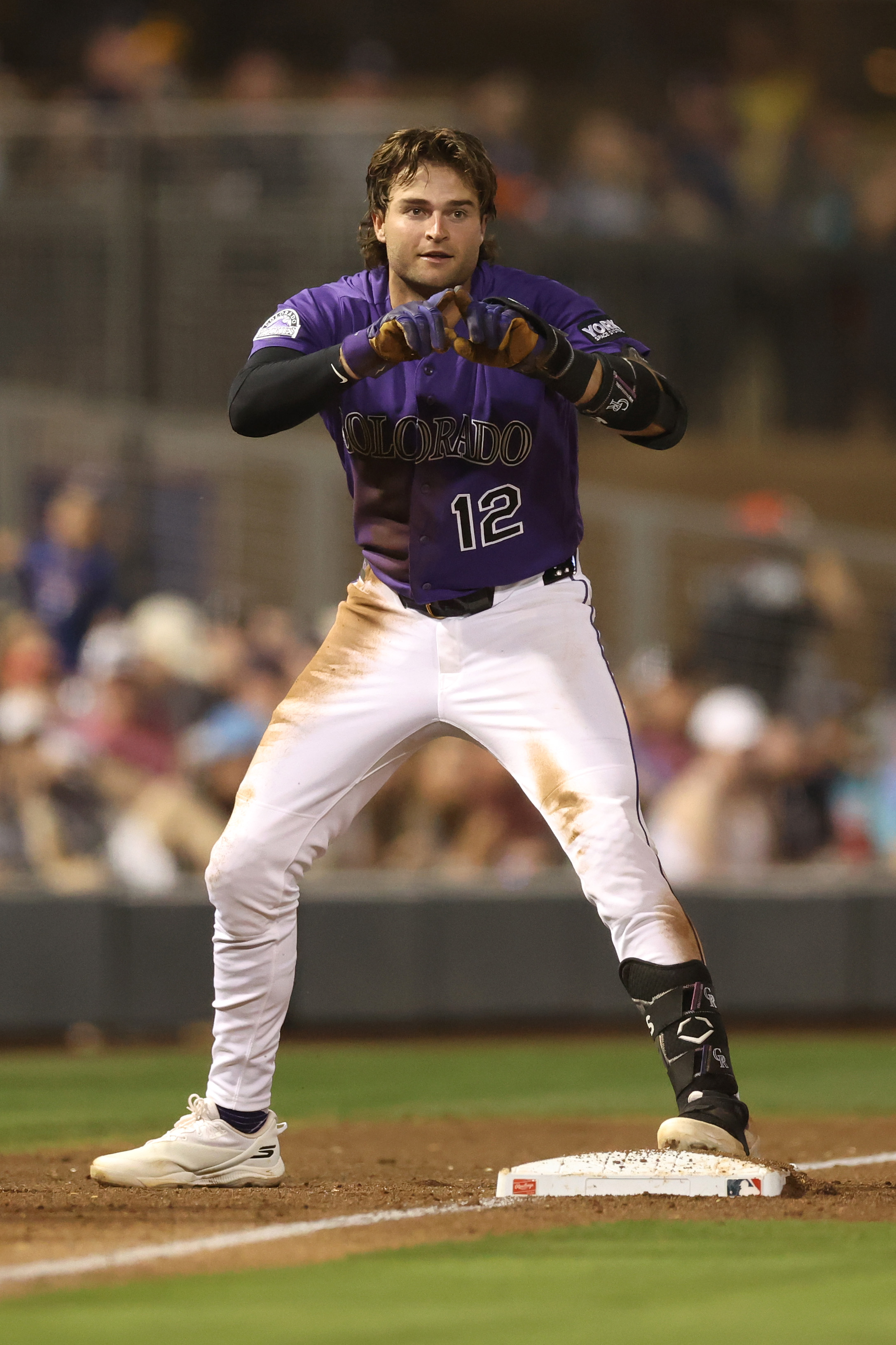 SCOTTSDALE, ARIZONA - MARCH 23: Kyle Karros #12 of the Colorado Rockies reacts after hitting a RBI triple against the Detroit Tigers during the fourth inning of a spring training game at Salt River Fields at Talking Stick on March 23, 2026 in Scottsdale, Arizona. (Photo by Chris Coduto/Getty Images)