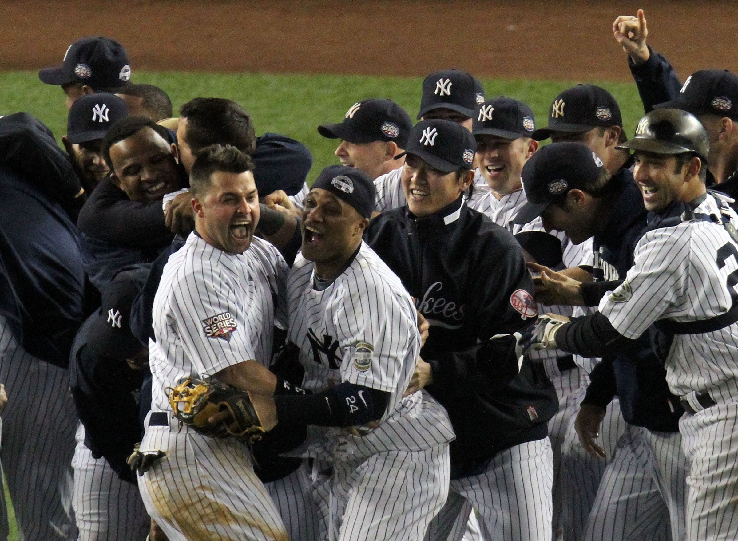 NEW YORK - NOVEMBER 04: (L-R) C.C. Sabathia, Nick Swisher, Robinson Cano, Chien-Ming Wang and Jorge Posada of the New York Yankees celebrate after their 7-3 win against the Philadelphia Phillies in Game Six of the 2009 MLB World Series at Yankee Stadium on November 4, 2009 in the Bronx borough of New York City. (Photo by Jim McIsaac/Getty Images)