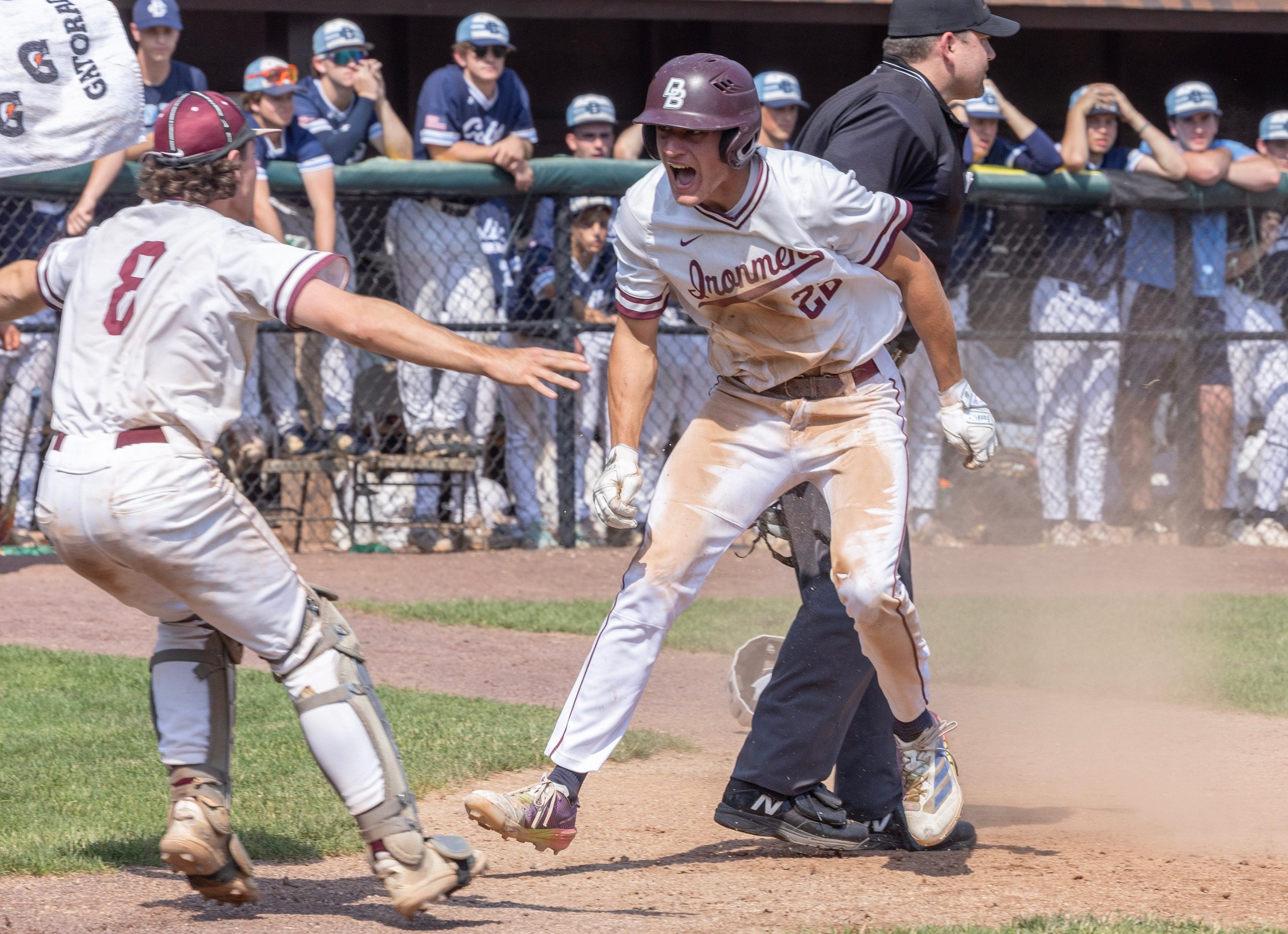 Don Bosco’s Nick Becker jumps into arms of Chase Bagley (8) after sliding into home with the winning run. Don Bosco Prep defeats Christian Brothers Academy, 5-4, in an 11-inning game for Non-Public A baseball title at Veterans Park in Hamilton, NJ on June 12, 2025. This game began on June 11 and was completed on June 12. It was suspended with a 4-4 tie at the end of eight innings due to township rules about park lights.