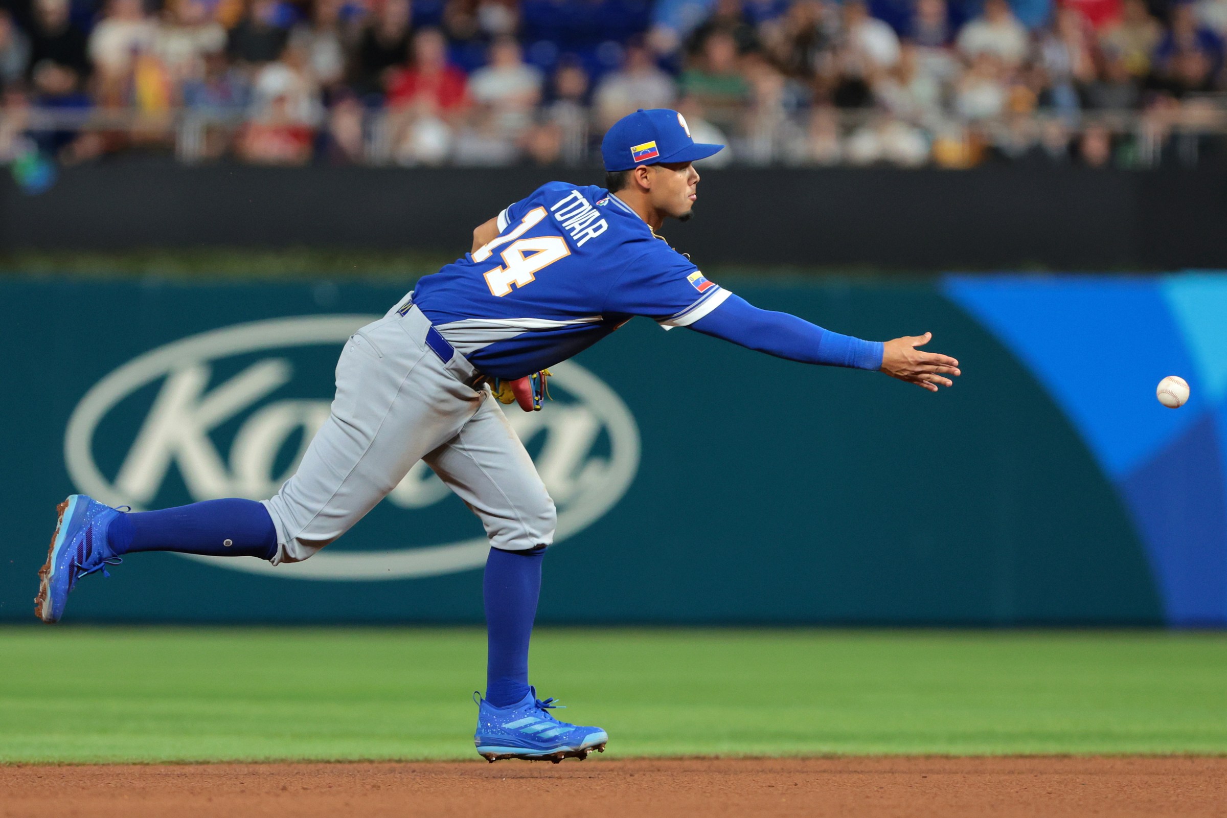 Mar 17, 2026; Miami, FL, United States; Venezuela shortstop Ezequiel Tovar (14) makes a throw to first base to get the out against the United States in the fourth inning during the 2026 World Baseball Classic Championship game at loanDepot Park. Mandatory Credit: Sam Navarro-Imagn Images