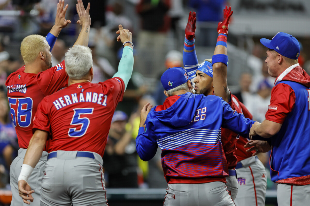 Mar 17, 2023; Miami, Florida, USA; Puerto Rico left fielder Eddie Rosario (17) celebrates with center fielder Enrique Hernandez (5) and pitcher Alex Claudio (58) after hitting a home run during the first inning against Mexico at LoanDepot Park. Mandatory Credit: Sam Navarro-USA TODAY Sports