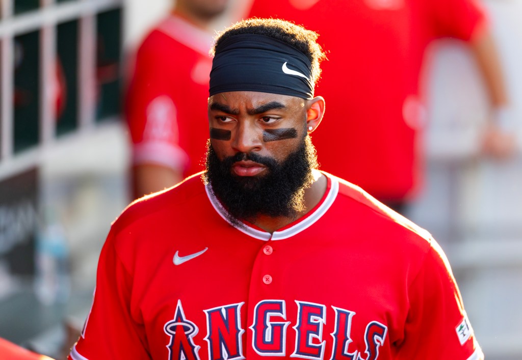 Los Angeles Angels outfielder Jo Adell in a red jersey with his team's name and logo.