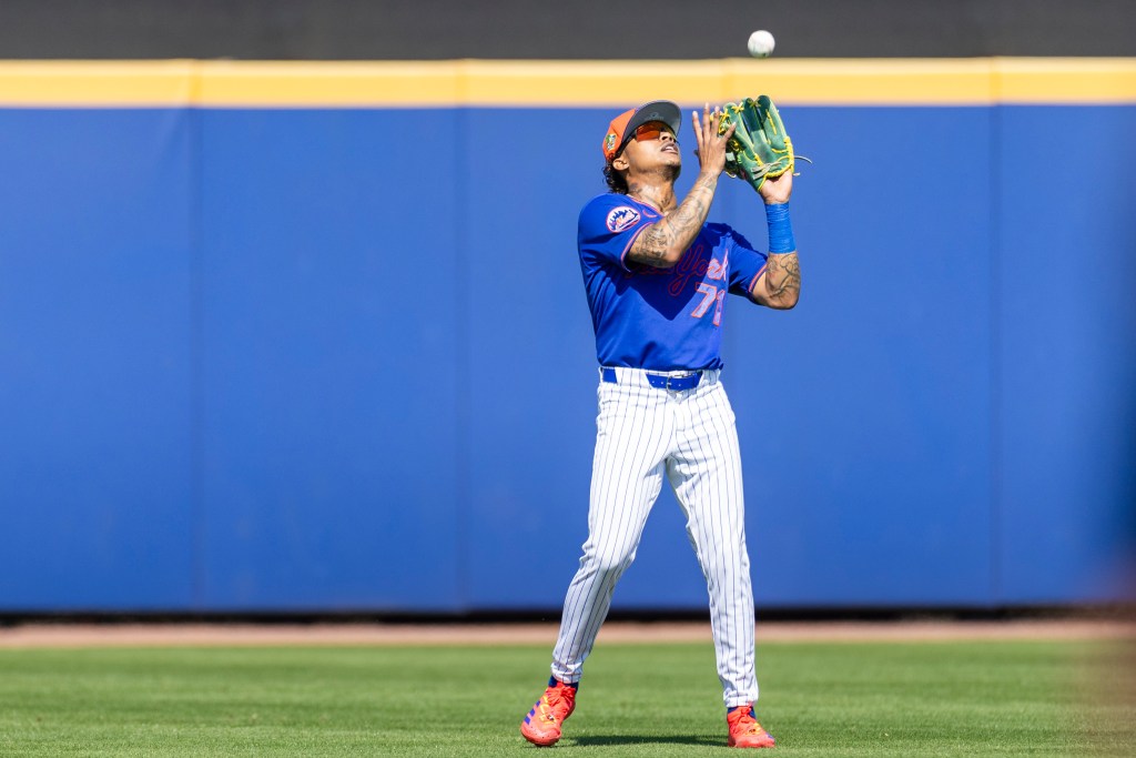 New York Mets center fielder Cristian Pache catching a fly ball.