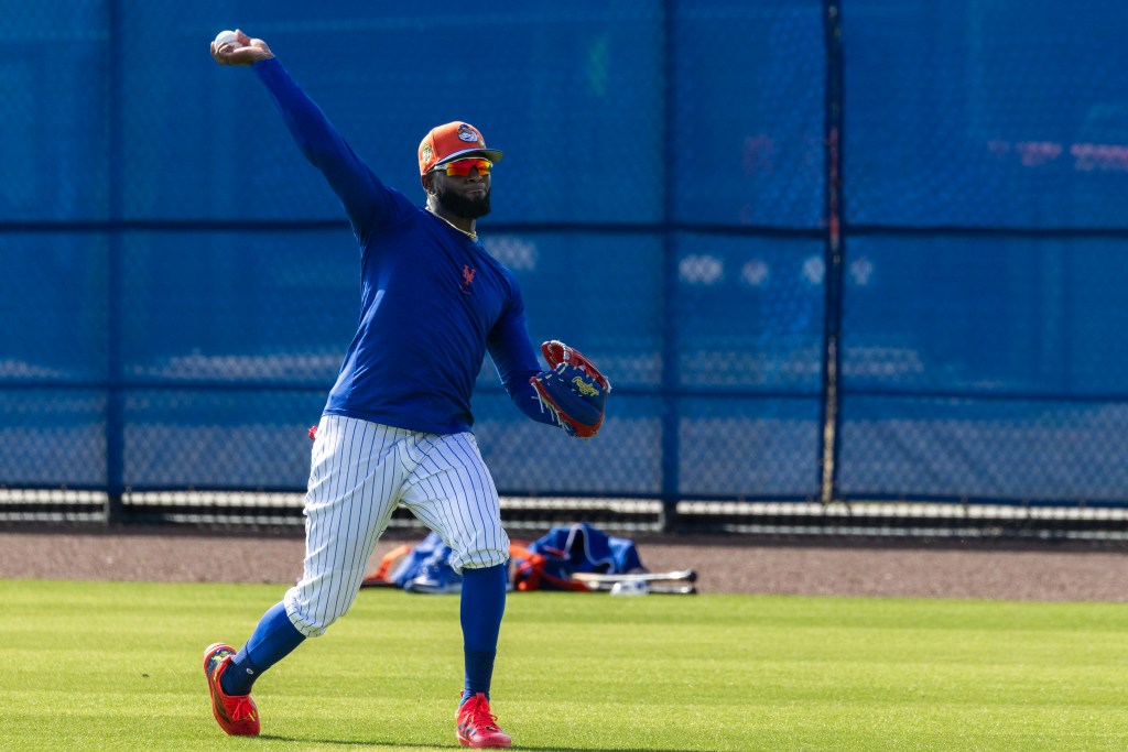 Luis Robert Jr. throws during Spring Training at Clover Field, Thursday, Feb. 19, 2026, in Port St. Lucie, FL.