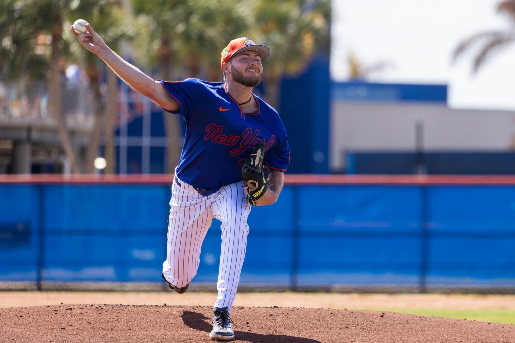 New York Mets pitcher Christian Scott throwing a baseball during spring training.