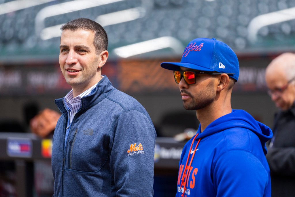 New York Mets president of baseball operations David Stearns and bench coach Kai Correa during a workout.
