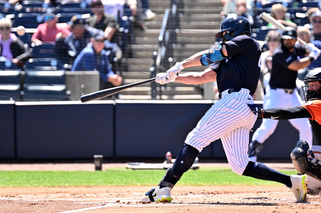New York Yankees designated hitter Giancarlo Stanton drives in a run with a sacrifice fly ball against the Baltimore Orioles.