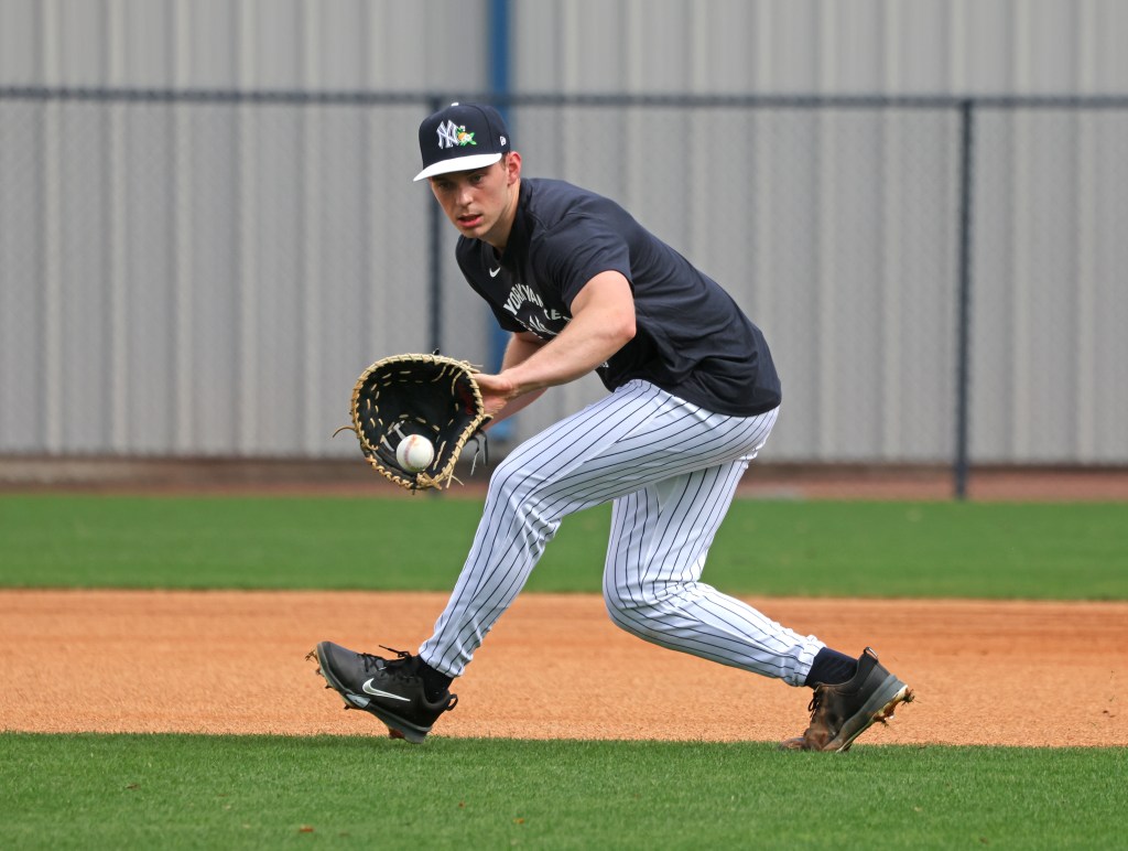 New York Yankees first baseman Ben Rice fielding a ball during practice at Steinbrenner Field.