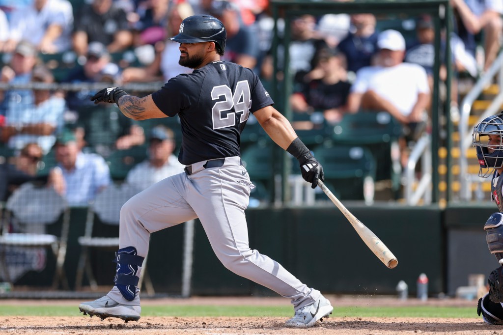 Yankees left fielder Jasson Domínguez (24) hits an rbi single against the Minnesota Twins in the fifth inning during spring training.
