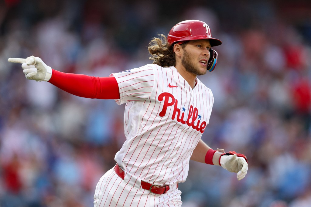 Philadelphia Phillies third baseman Alec Bohm (28) reacts after hitting a three RBI home run against the Texas Rangers.