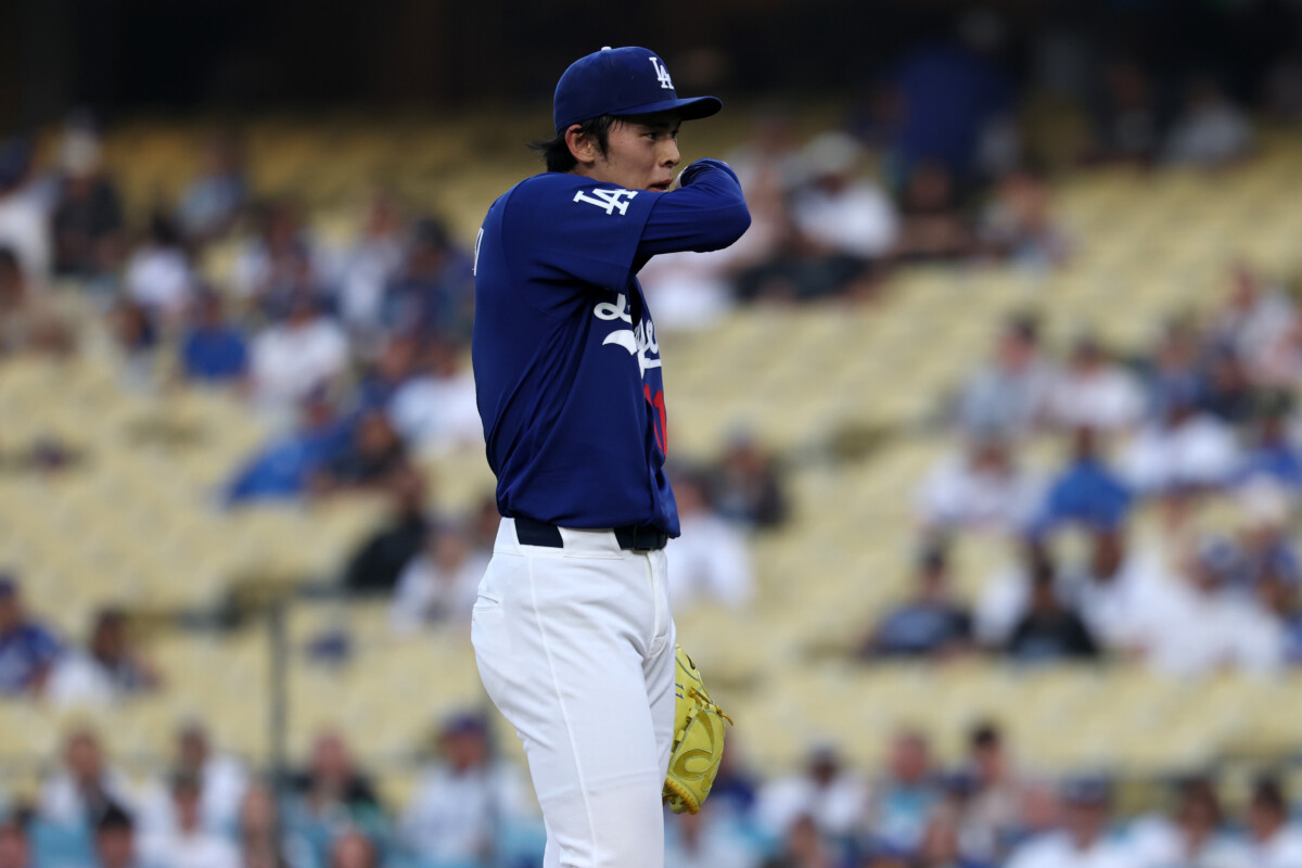 Mar 23, 2026; Los Angeles, California, USA; Los Angeles Dodgers pitcher Roki Sasaki (11) reacts after allowing a walk during the first inning against the Los Angeles Angels at Dodger Stadium. Mandatory Credit: Kiyoshi Mio-Imagn Images
