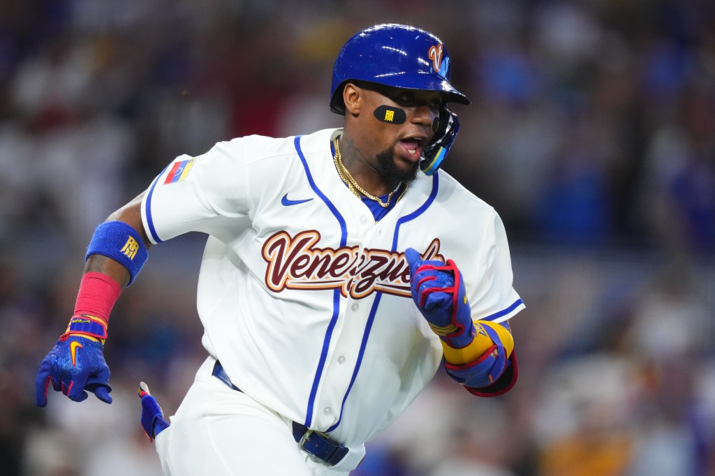 Ronald Acuña Jr. #21 of Team Venezuela running the bases during a 2026 World Baseball Classic game.