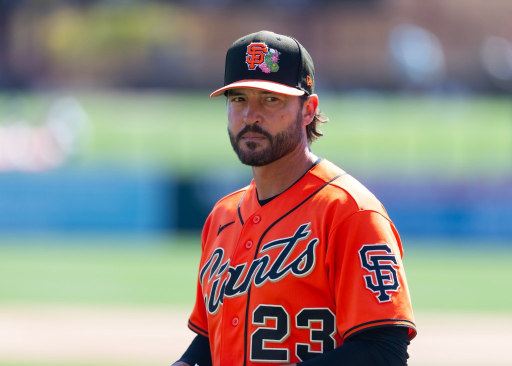 San Francisco Giants manager Tony Vitello in an orange jersey and black cap.