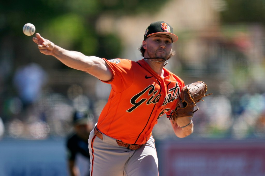 San Francisco Giants pitcher Landen Roupp throwing a baseball during a spring training game.