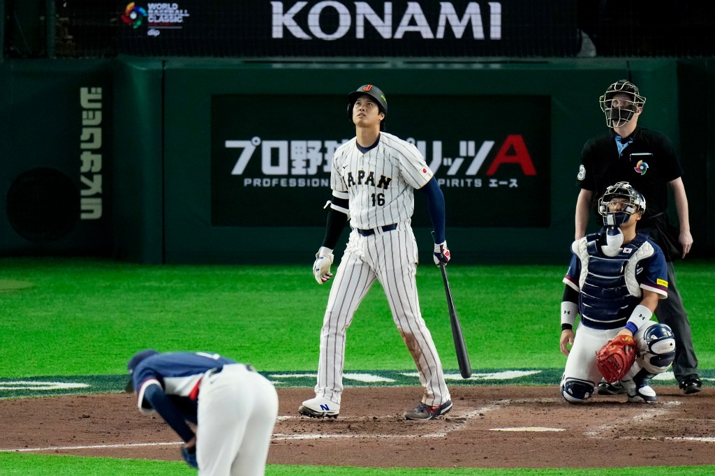 Shohei Ohtani #16 of Team Japan hits a solo home run.