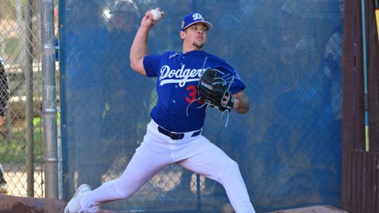 Los Angeles Dodgers pitcher Gavin Stone (35) throws during a Spring Training workout at Camelback Ranch. 
