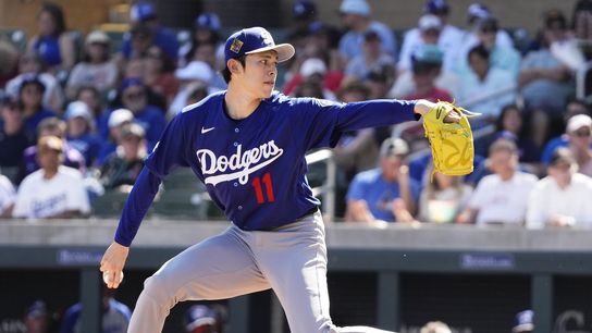 Los Angeles Dodgers pitcher Roki Sasaki (11) throws to the Arizona Diamondbacks in the first inning on Feb. 25, 2026, at Salt River Fields in Scottsdale 