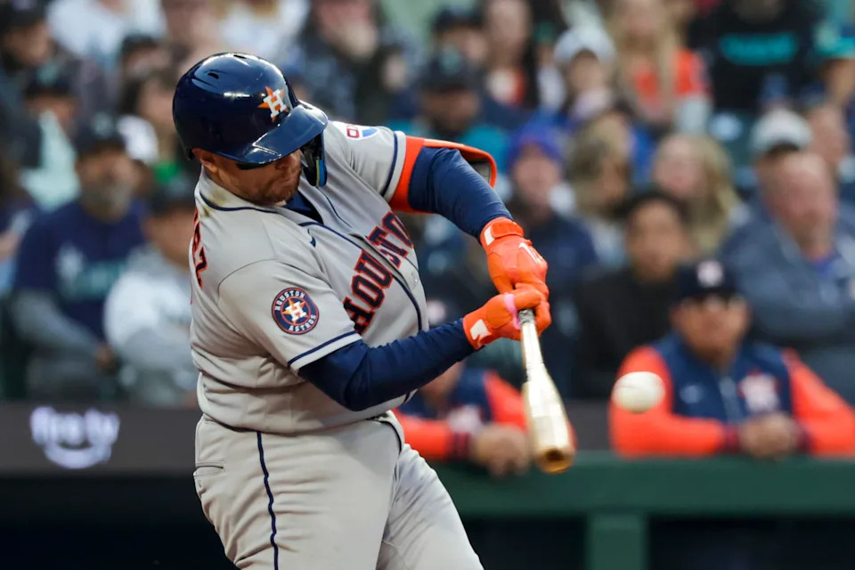 Houston Astros catcher Christian Vazquez hits a three-RBI double in a game against the Seattle Mariners on Friday at T-Mobile Park in Seattle. | Joe Nicholson/Imagn Images.