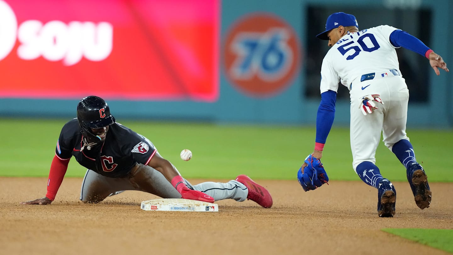 Mar 30, 2026: Cleveland Guardians right fielder Angel Martinez (1) steals second base against Los Angeles Dodgers shortstop Mookie Betts (50) during the fifth inning at Dodger Stadium.