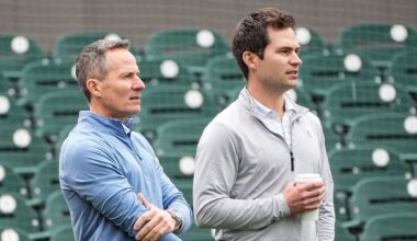 Detroit Tigers team owner Chris Ilitch, left, talks to president of baseball operation Scott Harris as they watch batting practice during spring training at Joker Marchant Stadium in Lakeland, Fla. on Thursday, Feb. 20, 2025.
